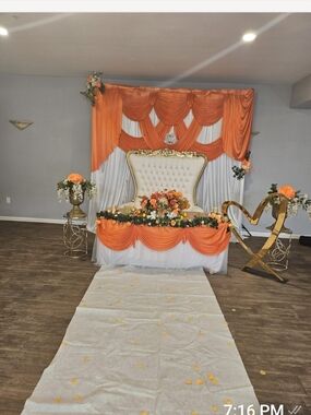 Orange and White Draped Event Backdrop with Floral Accents With Tablecloth